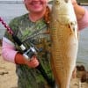 Waynes Custom Rods anglerette Whitney Holt of Porter fushed a finger mullet to catch this 27inch slot red