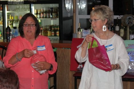 No gathering is complete without giving away door prizes. Georgia Osten and Sherry Morgan calling out the winning numbers.