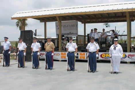Distinguished Members of the Southeast Texas Veterans Service Group stood in formation, rifles at the ready as a Memorial Wreath was uncovered and presented to the crowd. 