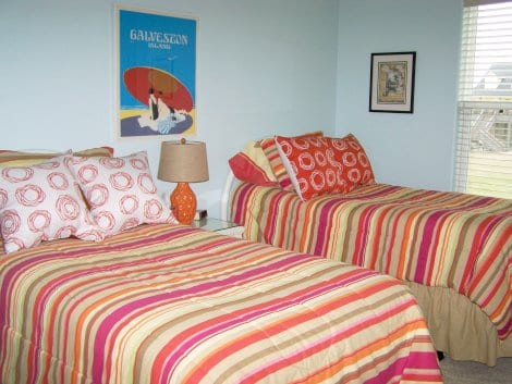 Here is the guest bedroom with twin beds and awesome vintage Galveston poster found at an estate sale. 