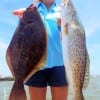 Angelina Soto of Baytown TX long-arming her flounder and speck she caught on soft plastic