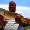 Choyce Dacis of Missouri City TX hefts this nice slot red fishing shrimp