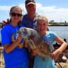 Father and Daughters, Michael Doerig with Andrea and McKinzie show off McKinzie's 24 inch drum she just caught on shrimp