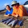 Father and daughter, Scott and Megan Pierce of Lufkin TX, wade fished the surf for these Mackerel and trout they caught on gold spoons