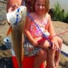 Grandma G.G. Grigance hugs 5yr old Grandaughter- Madalynn Poirier of Livingston TX after catching her very first Redfish- A 32 inch bull- she caught on her Barbie Fishing pole