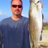 Heading for Church, Mark Henbree of Crystal Beach took a quick wade in the surf to catch this nice speck on a gold spoon