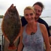 Jason and Bobbie Darby of Beaumont TX showing off Bobbie's nice flounder she caught on a finger mullet