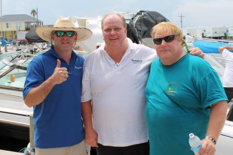 Brad Vratis, owner of Stingaree Restaurant and Marina, with Boat Club Vice-President Mike Stone and President Pat Patrick.