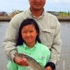 Father and Daughter- James Lee shows off Maya Lee's speck that was caught on live shad