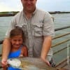 Father and Daughter- Rob Willoughby and Kaylie of Tarkington Prairie show off Kaylie's 23inch slot red she caught on a finger mullet