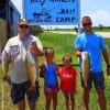 Fishin buds- Boyd Lamb with 5yr old Isabella of Livingston teamed up wth Rob Willoughby and Kaylie of Tarkington Prairie to catch this speck and slot reds