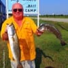 Gilchrist angler Perry Weir shows off two of his 4 specks he took on touts