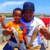 Ryan Gonzales of Katy along with 4yr old Ryan Jr. gives a thumbs up to Jr's whiting catches he took on shrimp