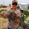 Spencer Broadway of Anahuac TX hefts this nice keeper eater drum caught on live shrimp