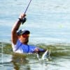 Surf wader hooks up to a chicken trout-- fun fun fun