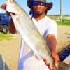 Vern Watson of Dayton TX waded the surf with soft plastic to nab this 26inch speck