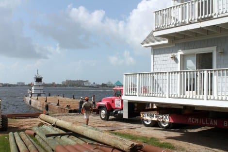 Starting the move onto the barge at the Offatts Bayou property