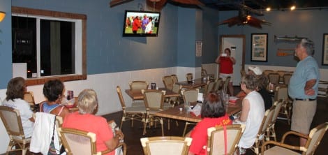 A handful of Texas Crab Festival volunteers gathered at Barefoot Bill's American Grill on Monday night to watch the program.