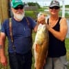 Carl and Sara Rice of Splendora TX caught and tagged this HUGE 47inch Bull Red while fishing crab