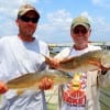 Father and Son- The Wildman's of Channelview TX took these 24 and 26inch slot reds on fingrer mullet