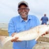 Felton Coomier of Houston caught this nice 27inch slot red on live shrimp