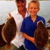 Grandad and grandson- Rob Hudson of Vidor with grandson Trenton took these fine 21 and 17inch flounder
