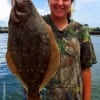 Kaily Girouard of Buna TX fished a finger mullet to catch this nice 19inch flounder