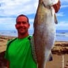 Kevin Creamer of Woodville TX wade fished the surf with live croaker to nab this 24inch speckled trout