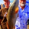 Pat and Marlin Macon of Port Arthur TX took this nice 25inch slot red on shrimp