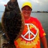 Terri Arrington of Jacksonville TX nabbed her very first flounder here at Rollover she caught on a finger mullet