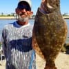 Alton Thorpe of Gilchrist TX hefts this really nice flounder caught on finger mullet