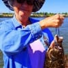 Betty Camp of Thickett TX hefts these nice flounder caught on finger mullet