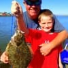 First Flounder- praised Dad- as Brad Hultman of Springtown TX hugged his son 7yr old Garrett after taking this nice flounder on a finger mullet