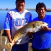 Fishin buds Juan Luna and Fernando Gomez of Houston teamed up to land this HUGE tagger bull red caught on cut sand trout