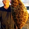 High Islander Joe Andres took this 21inch BAD BOY flounder on an early tide finger mullet