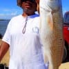 Houston angler Karl Dever hefts this nice 28inch slot red caught on a finger mullet