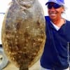 Lee West of Gilchrist TX hefts this really nice flounder caught on Berkley Gulp