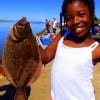 Pretty little Samyra Beckham of New Orleans LA shows off her nice flounder she caught on shrimp