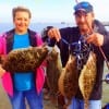 Bridget and Chuck Greene of Little Cypress TX show off their November limit topped with her 22 inch flounder she caught on Berkley Gulp