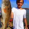 Catching his very first redfish Jacob Schultz of Fort Worth told of hooking the 28inch slot red on a finger mullet