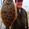 Crystal Beach TX wade-angler Gary Mann worked Berkley Gulp in Rollover Bay to tether up this nice flounder