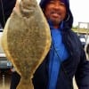 HURRY UP ED shivered Karl Dever of Houston holding up his 19 inch flounder- its, its, cold out here