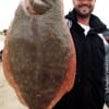 Hamshire TX angler Scott Ray waded Rollover Bay to catch this 23 inch doormat flounder on Berkley Gulp