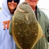 Jannai and Mark McClelland of Beaumont TX show off Jannai's nice flounder she caught on Berkley Gulp