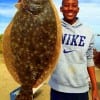 Javon Lowery of Pearland TX caught this nice 20inch doormat flounder on a finger mullet
