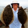 Joyce Linton of Houston fished finger mullet to nab these 22 and 18 inch flounder