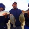 Kileen TX anglers Richard Smith along with Nicholas and Cameron Nesbet took these nice slot reds and flounder on finger mullet