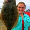 Kira Barlow of High Island TX caught this nice 18inch flounder while fishing with a finger mullet
