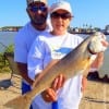 Marc and Rebecca Allison of Chandler TX teamed up to catch this nice 25inch slot red that she took on a Miss Nancy mud minnow
