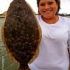 Sharon Magana of Richmond hefts this nice flounder caught on Berkley Gulp